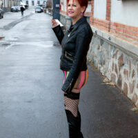Sixty plus ginger-haired woman Caroline Hamsel tempts a couple of studs on the street in slutwear