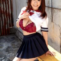 Asian solo girl Ria Sakuragi sets her big all natural tits loose from a cute sailor uniform