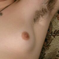Euro first-timer with pierced nipples shows her hairy underarms and bush
