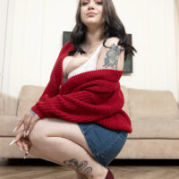 Tattooed babe Kira Clark releases her big titties in high-heeled shoes