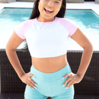 Diminutive Latina teener Summer Col is disrobed to over the knee socks and joggers by a pool