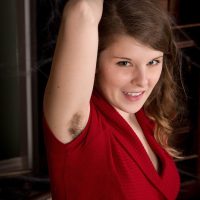 Tattooed first-timer Jada exposes her wooly underarms and pubic hair as she takes off her red dress