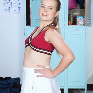 Young cheerleader Lexy demonstrates her flexibility while going disrobed to the waistline in cotton underwear