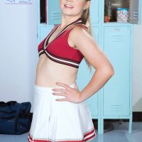 Young cheerleader Lexy showcases her flexibility while going unclothed to the mid-body in cotton panties