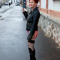Sixty plus red-haired Caroline Hamsel entices a couple of men on the street in slutwear