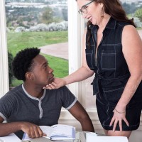 Over 60 woman Maria Fawndeli tempts a younger ebony guy while tutoring him